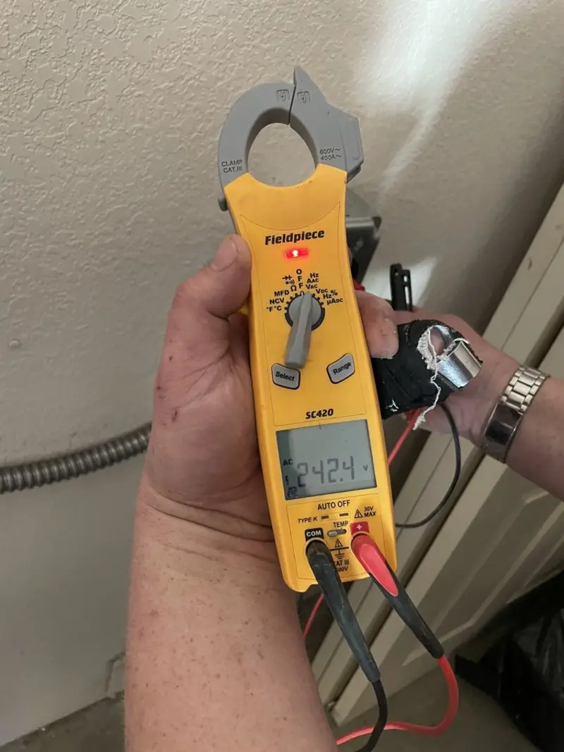 Voltage testing with clamp meter during Electrical Installation Services in Greenbrier